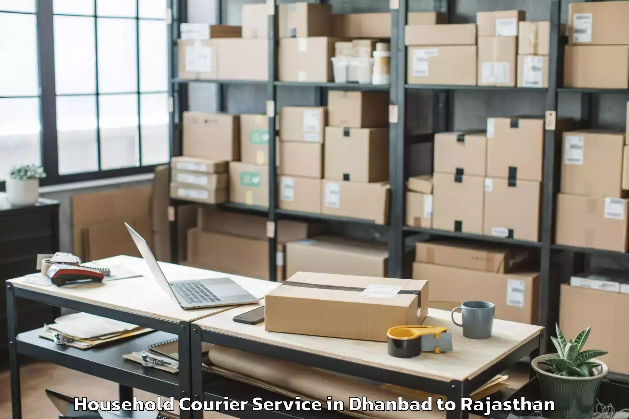 Top Dhanbad to Kherwara Household Courier Available